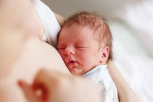 one-day-old-newborn-baby-with-mother-PJGTTRE-scaled-1-300x200