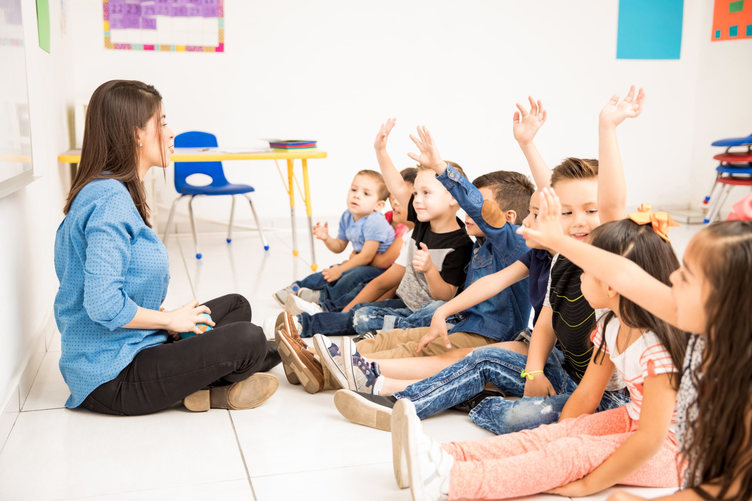 profile-view-group-preschool-students-raising-their-hands-trying-participate-school-scaled
