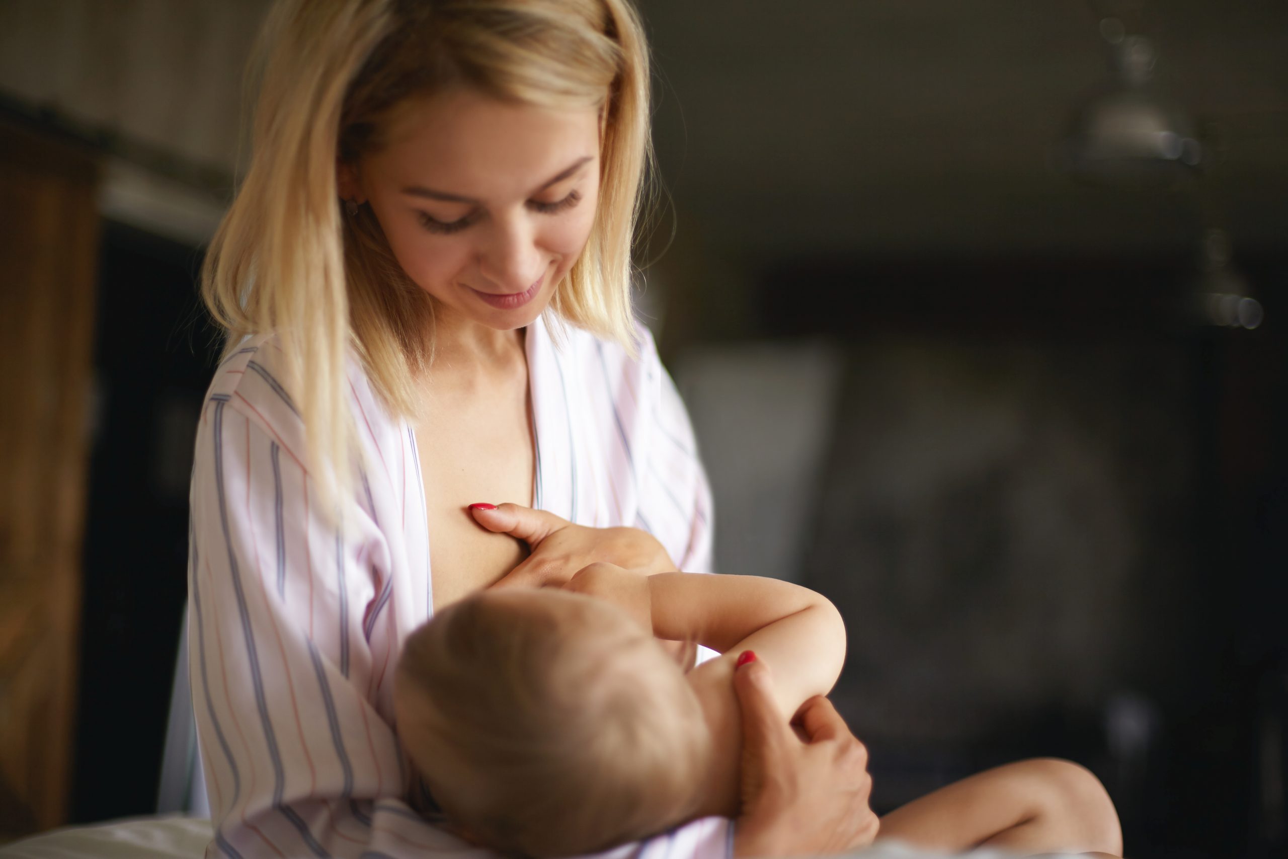 newborn-children-infancy-childcare-motherhood-concept-sleepy-young-mother-with-messy-blonde-hair-breastfeeding-her-infant-son-night-pretty-mom-giving-breast-seven-month-old-child-scaled.jpg